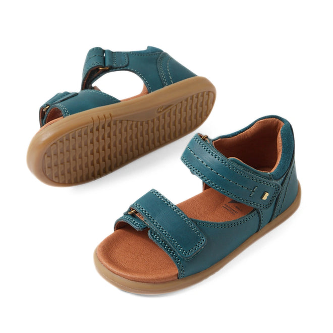 Two Mediterranean green open-toed sandals with brown soles and adjustable Velcro straps, shown from the side and bottom angles on a white background; these stylish Bobux IWalk Driftwood Sandal Mediterrainean Green Open Toe toddler boys’ leather sandals offer both comfort and durability., 9420074807601, 9420074807618, 9420074807625, 9420074807632, 9420074807649