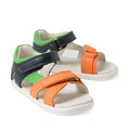 Introducing the Bobux IWalk Dune Toddlers Sandal Navy Open Toe: these leather-style toddler sandals feature white soles and adjustable velcro straps in navy blue, orange, and green for a secure, comfortable fit. Gold decorative buckles add a stylish touch, while the open toe and heel design provide breathability—perfect for active little ones.