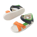 The Bobux IWalk Dune Toddlers Sandal Navy Open Toe features orange, green, and navy blue straps with white soles and Velcro closures, offering both style and comfort. These adjustable toddler sandals are displayed from the top and bottom to clearly showcase their practical design., 9420074855145, 9420074855152, 9420074855169, 9420074855176, 9420074855183