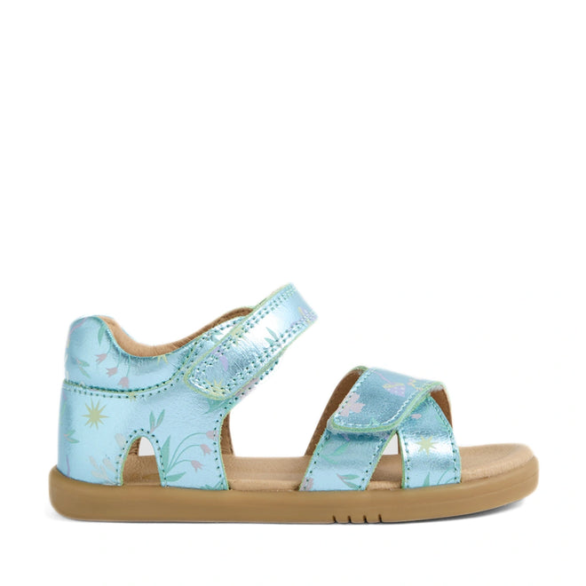 The Bobux IWalk Flora Toddlers Sandal in Jelly Mint Metallic Blue features a charming floral print, two adjustable Velcro straps, an open toe and heel design, and a tan rubber sole—perfectly crafted for children.