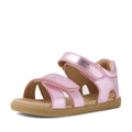 The Bobux IWalk Flora Toddlers Sandal in Pink Lemonade features a pink metallic design with two velcro straps and an open toe, crafted from breathable leather for comfort. This stylish toddler sandal boasts a tan rubber sole and visible stitching details.