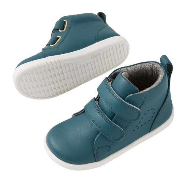 The Bobux IW Iwalk Grass Court Hi Leather Boot in Mediterranean Green for toddlers features a high-top style with white soles, two adjustable straps, gold eyelets, and a textured sole. One shoe is shown from the top/side, the other displays the sole., 9420074856814, 9420074856821, 9420074856838, 9420074856845