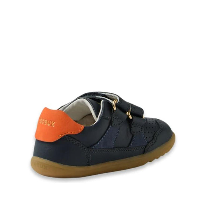 The Bobux IW Iwalk Hunter Leather Sneaker Navy is a kids' leather shoe featuring a brown sole, two adjustable straps, perforated details, and an orange heel accent. The side and back view shows the Bobux brand name on the heel tab., 9420074834096, 9420074834102, 9420074834119, 9420074834126