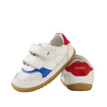 The Bobux IW Iwalk Hunter Leather Sneaker White Salsa is a kids' white leather sneaker with blue and red accents, brown rubber soles, two velcro straps, and a red heel featuring the BOBUX brand name in gold., 9420074834232, 9420074834249, 9420074834256, 9420074834263, 9420074834270