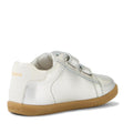 The Bobux IW Iwalk Maverick Leather Sneaker in metallic silver is shown from the back left, featuring beige laces, a light brown rubber sole, and the BOBUX logo on the heel. Crafted from breathable leather for kids' comfort against a white background., 9420074836472, 9420074836489, 9420074836496, 9420074836502, 9420074836519