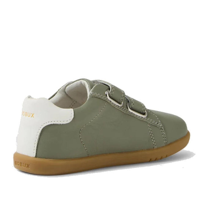 The Bobux IW Iwalk Maverick Leather Sneaker in Vetiver Green features olive green leather, a white heel accent, two adjustable straps, and a light brown rubber sole. Shown from a rear side angle, the shoe is crafted from breathable leather for kids., 9420074836427, 9420074836434, 9420074836441, 9420074836458, 9420074836465