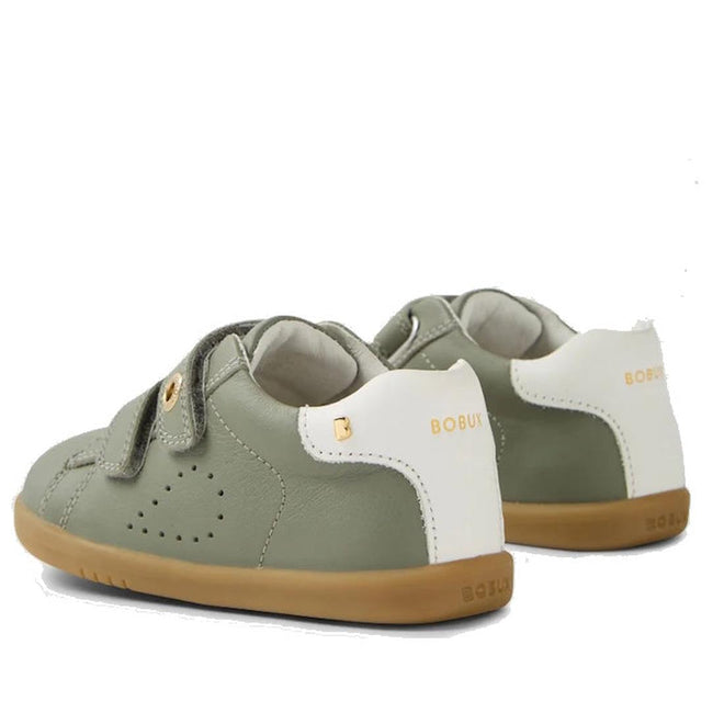 The Bobux IW Iwalk Maverick Leather Sneaker in Vetiver Green features a sage green and white leather design, tan rubber soles, adjustable Velcro straps, perforated detailing for breathability, and gold BOBUX branding on the heel for kids., 9420074836427, 9420074836434, 9420074836441, 9420074836458, 9420074836465