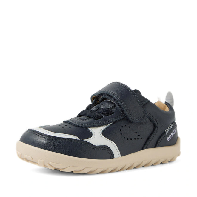 The Bobux IW Iwalk Neo Toddlers Leather Sneaker Navy Barefoot is a navy blue and white toddler leather sneaker with a beige sole, Velcro strap, decorative stitching, and a zero drop sole for natural foot movement, shown on a white background., 9420074854759, 9420074854766, 9420074854773, 9420074854780