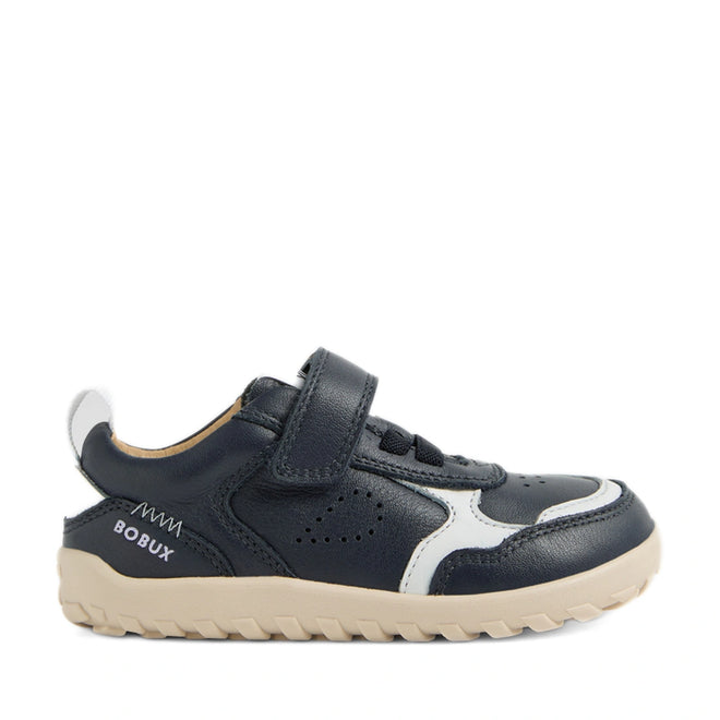 The Bobux IW Iwalk Neo Toddlers Leather Sneaker in Navy is a children’s sneaker designed with barefoot shoe principles for natural movement, featuring a navy leather upper with white accents, a Velcro strap, beige zero-drop sole, and the BOBUX brand name on the heel., 9420074854759, 9420074854766, 9420074854773, 9420074854780