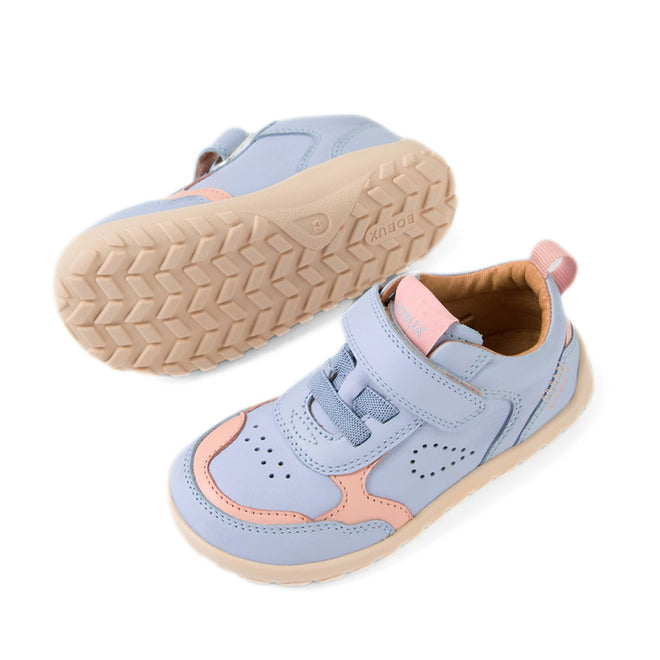 The Bobux IW Iwalk Neo Toddlers Leather Sneaker Skyway Blue Barefoot is shown here in pastel blue and pink with beige soles, designed in a barefoot shoe style with a zero-drop sole. One sneaker is pictured from the side and one from the bottom, showcasing the velcro strap and breathable construction for ultimate comfort., 9420074854711, 9420074854728, 9420074854735, 9420074854742