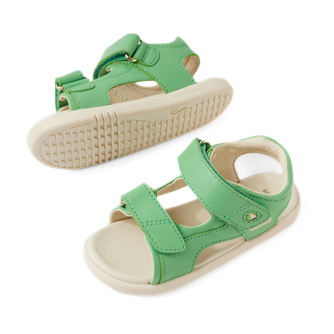 A pair of Bobux IWalk Strand Sandal Retro Green Open Toe toddlers leather sandals with beige soles, featuring adjustable straps and open toes, displayed on a white background.