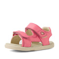 The Bobux IWalk Strand Sandal in Pink Lemonade features a leather design with adjustable Velcro straps, an open toe and heel, and a light beige sole—making these comfortable sandals perfect for toddlers’ little feet.