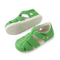 A pair of Bobux IWalk Tidal Sandal Retro Green Closed Toe Toddlers with white soles is displayed from top and side angles on a plain white background. These water-friendly, closed-toe sandals are crafted from premium leather, making them perfect for active toddlers., 9420074807700, 9420074807717, 9420074807724, 9420074807731, 9420074807748