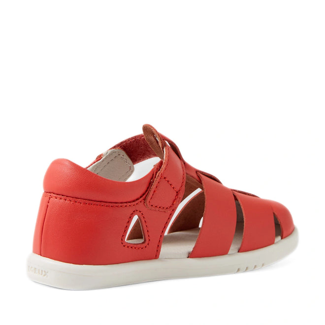 A Bobux IWalk Tidal Sandal in Grenadine Red is shown from the back and side. This closed-toe toddler sandal features wide straps and a small triangular cutout near the heel, offering a water-friendly design that’s ideal for summer adventures., 9420074807755, 9420074807762, 9420074807779, 9420074807786, 9420074807793