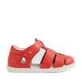 The Bobux IWalk Tidal Sandal in Grenadine Red is a closed-toe toddler sandal featuring a white sole, velcro strap, and side cut-out details, shown from a side profile. Water-friendly and designed for active days, these sandals combine protection and style for little feet., 9420074807755, 9420074807762, 9420074807779, 9420074807786, 9420074807793