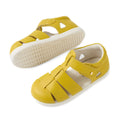 A pair of Bobux IWalk Tidal Sandal Mango Mint Closed Toe Toddlers featuring a vibrant yellow design, white soles, Velcro straps for easy adjustment, and a comfortable fit. Crafted from water-friendly leather, these sandals are ideal for active toddlers—one sandal is pictured upright while the other is flipped to display its sole., 9420074807908, 9420074807915, 9420074807922, 9420074807939, 9420074807946