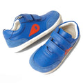 The Bobux Step Up SU Champ II Sneaker Olympian Blue is a pair of blue toddler sneakers with white soles, light blue suede accents, orange teardrop designs on the sides, and two velcro straps for easy fastening., 9420068552319, 9420068552326, 9420068552333