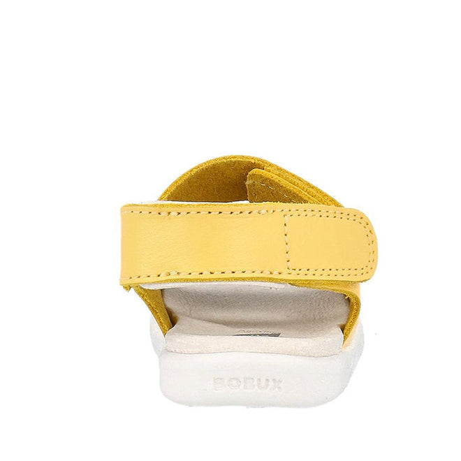 A back view of the Bobux Iwalk IW Quick Dry Topia Sandal 651304 Pineapple, a yellow children’s leather sandal with a white sole and adjustable straps. “BOBUX” is embossed on the heel of the sole., 9420075776302, 9420075782150, 9420075780248, 9420075779037, 9420075781665