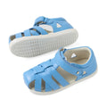 A pair of Bobux Iwalk IW Tropicana II Baltic Sea Blue leather sandals for toddlers, featuring closed-toe protection, open sides, and white rubber soles. One sandal is displayed upright while the other shows the sole., 9420074810250, 9420074810267, 9420074810274, 9420074810281, 9420074810298