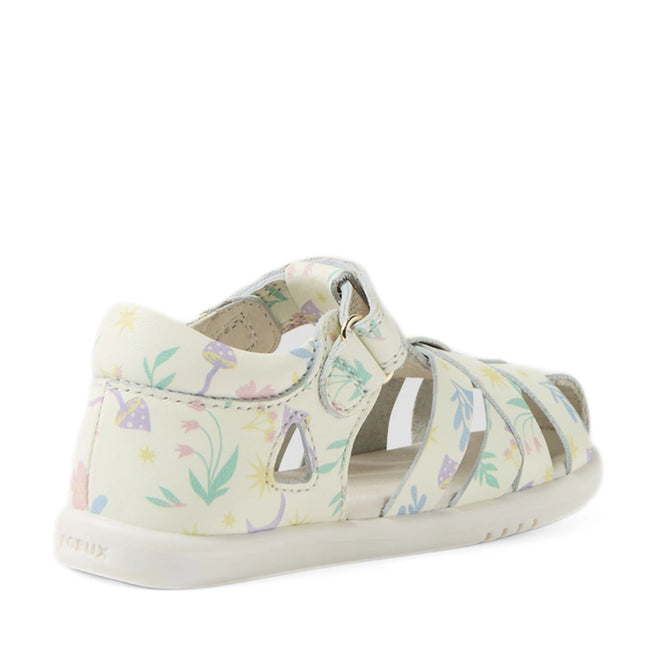 The Bobux Iwalk IW Tropicana II White Floral Leather Sandal is a children’s sandal designed with closed-toe protection and a closed heel, showcasing a charming pastel floral and mushroom print, a white sole, and an easy hook-and-loop strap—perfect for little explorers and inspired by the playful style of Bobux Tropicana toddlers., 9420074810304, 9420074810311, 9420074810373, 9420074810380, 9420074810397