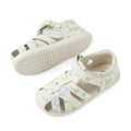 A pair of Bobux Iwalk IW Tropicana II White Floral Leather Sandals for toddlers, featuring a closed-toe design, pastel floral patterns, and adjustable Velcro straps, displayed from side and bottom angles on a white background., 9420074810304, 9420074810311, 9420074810373, 9420074810380, 9420074810397