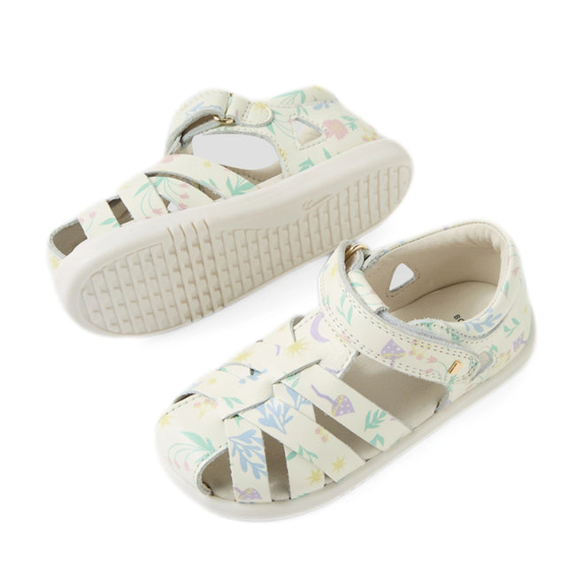 A pair of Bobux Iwalk IW Tropicana II White Floral Leather Sandals for toddlers, featuring a closed-toe design, pastel floral patterns, and adjustable Velcro straps, displayed from side and bottom angles on a white background., 9420074810304, 9420074810311, 9420074810373, 9420074810380, 9420074810397