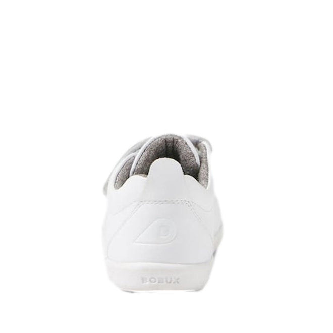 The Bobux - Iwalk Grass Court Sneaker Optical White 640510 is a white leather kids' sneaker seen from the back, featuring an embossed “B” logo on the heel, double velcro straps, gray inner lining, and “BOBUX” embossed on the sole., 9420068518094, 9420075761254, 9420075761278, 9420075761995, 9420075761261