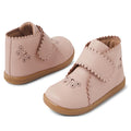 The Bobux IW Iwalk Willow Leather Boot in Cameo Rose Pink features scalloped edges, butterfly cutout designs, tan soles, and adjustable hook-and-loop straps for toddlers.