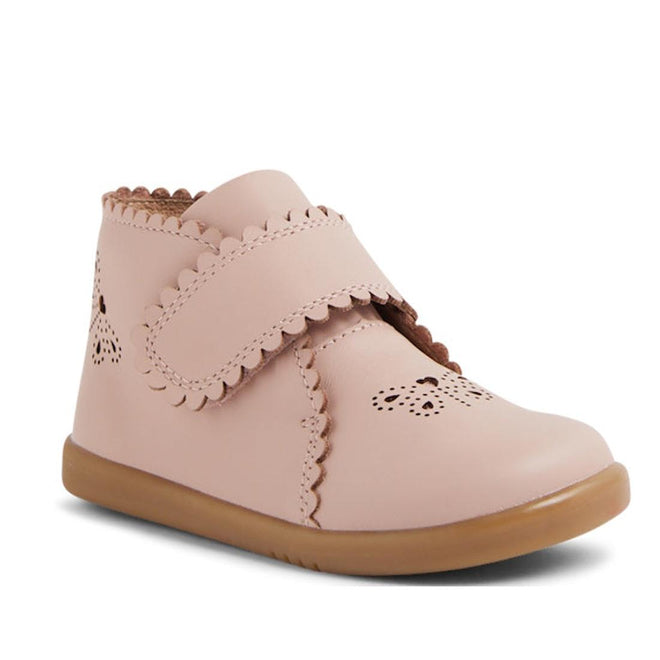 The Bobux IW Iwalk Willow Leather Boot Cameo Rose Pink features scalloped edges, cut-out patterns, an adjustable Velcro strap, and a light brown rubber sole—ideal stylish walking shoes for toddlers., 9420068545120, 9420068545137, 9420068545144, 9420068545151