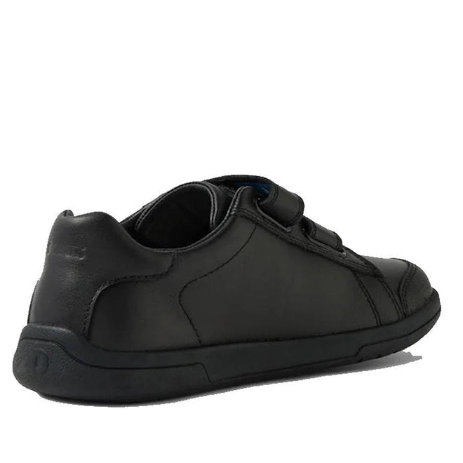 The Bobux Kid+ Jacks Black School Leather Shoe Sneaker is a kids’ low-top leather school shoe with adjustable Velcro straps and a scuff-resistant toe cap, shown from the back left angle on a white background., 9420074842299, 9420074842305, 9420074842312, 9420074842329, 9420074842336, 48400, 48401