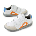 Introducing the Bobux KP Kids Plus Blaze Leather Sneaker in White Orange: these children’s sneakers feature premium white leather with vibrant orange and blue accents, gray soles, beige toe caps, and two velcro straps for easy fastening. Designed with a cushioned insole for extra comfort, they’re the perfect choice for active kids on the move.