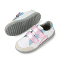 Introducing the Bobux KP Kids Plus Blaze Leather Sneaker in White Pink Metallic: this pair features soft white leather with playful pink, blue, and green accents, plus eye-catching metallic pink Velcro straps. One sneaker is displayed upright while the other lies sideways to showcase its gray textured sole. Designed with a cushioned insole for extra comfort, these sneakers are ideal for active little feet.