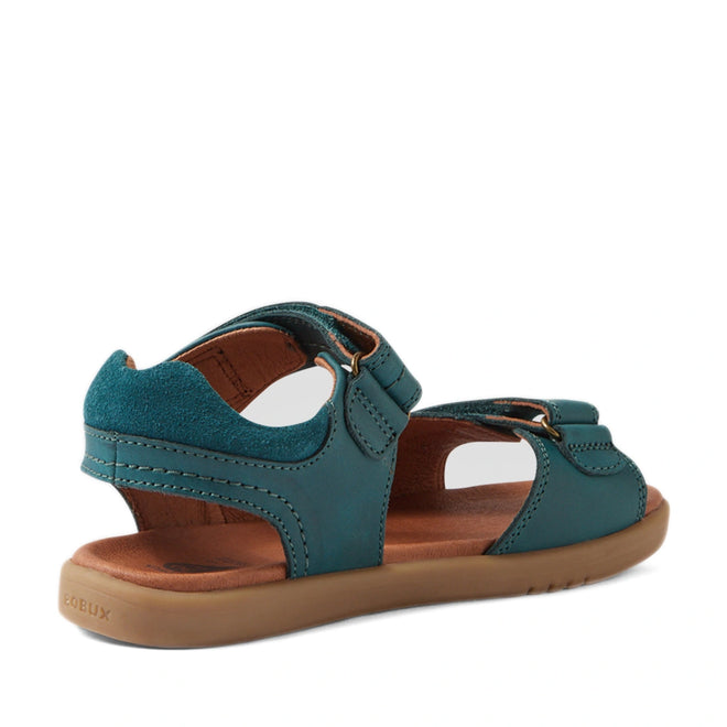 A Mediterranean Green Bobux KP Kids Plus Driftwood Leather Sandal, designed with adjustable straps and a cushioned brown sole, is shown at an angle highlighting the back and side—ideal for boys searching for stylish and comfortable leather sandals for everyday adventures., 9420074859013, 9420074858993, 9420074859006, 9420074858979, 9420074858962, 9420074858986, 9420074858955