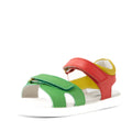 Bobux KP Kids Plus Dune Leather Sandal Grenadine Red—a child’s sandal crafted from leather, featuring adjustable green, yellow, and red straps on a white sole and shown from an angle for a vibrant look., 9420074855688, 9420074855695, 9420074855701, 9420074855718