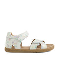 The Bobux KP Kids Plus Flora Leather Sandal White Floral features a tan sole and white leather straps adorned with pastel-colored nature-inspired prints, including leaves, mushrooms, stars, and delicate floral accents. Designed for comfort, these adjustable open-toe sandals have secure hook-and-loop fasteners for an easy, customizable fit.