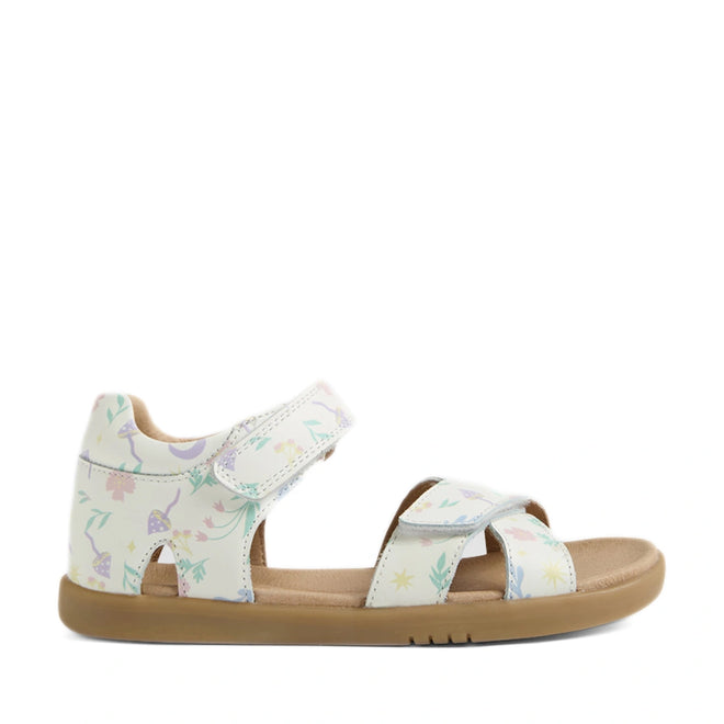 The Bobux KP Kids Plus Flora Leather Sandal White Floral features a tan sole and white leather straps adorned with pastel-colored nature-inspired prints, including leaves, mushrooms, stars, and delicate floral accents. Designed for comfort, these adjustable open-toe sandals have secure hook-and-loop fasteners for an easy, customizable fit.