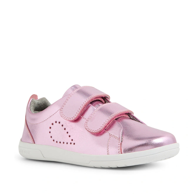 A shiny pink metallic Bobux KP Kids Plus Grass Court 2 II Leather Sneaker featuring two Velcro straps, a white sole, heart-shaped perforated dots on the side, and designed for a wide fit.