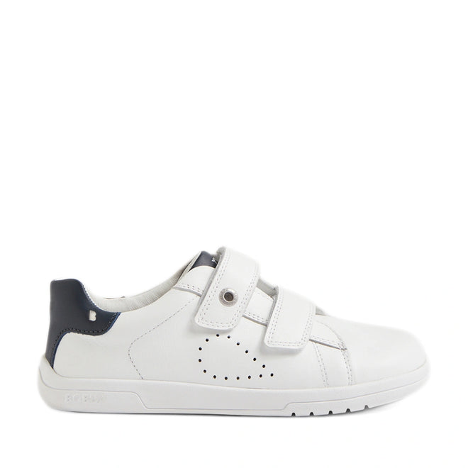 The Bobux Kid+ Plus KP Maverick Leather Sneaker in White Navy features white leather, two adjustable Velcro straps, subtle side perforations, and a dark blue heel accent. Designed for kids, these sneakers have a low profile and a flat rubber sole., 9420074860217, 9420074860224, 9420074860231, 9420074860248, 9420074860255