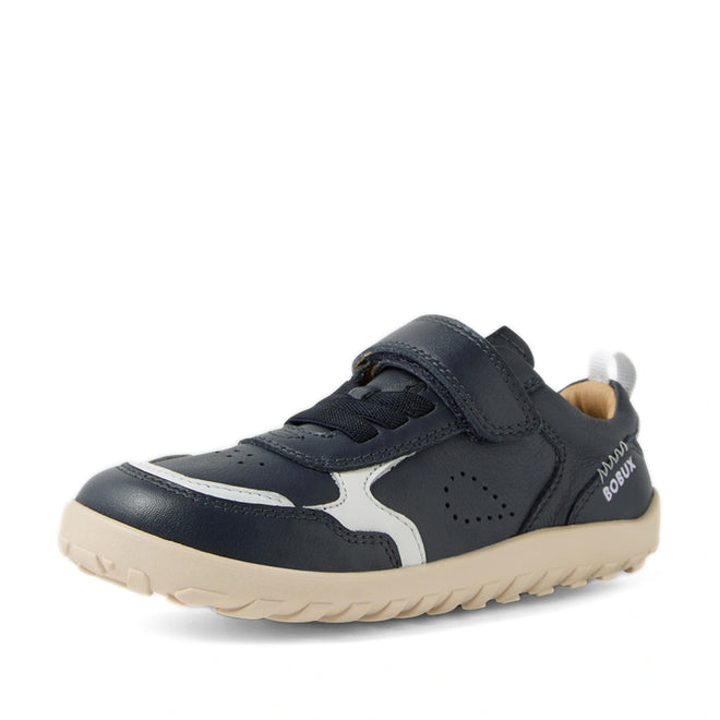 The Bobux Kid+ Plus KP Neo Leather Sneaker Navy Alpha is a kids’ navy leather sneaker featuring a barefoot-shaped toebox for natural movement and comfort, a beige sole, white accents, and a Velcro strap. The shoe displays the BOBUX brand name on the heel and includes a pull tab at the back., 9420074847690, 9420074847706, 9420074847713, 9420074847720, 9420074847737, 9420074847744, 9420074847751
