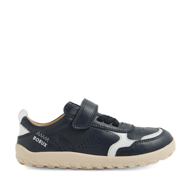A kids’ sneaker, the Bobux Kid+ Plus KP Neo Leather Sneaker Navy Alpha, features navy blue and white leather, a barefoot-shaped toebox, beige zero drop sole, Velcro strap fastening, and has “Bobux” printed on the side., 9420074847690, 9420074847706, 9420074847713, 9420074847720, 9420074847737, 9420074847744, 9420074847751