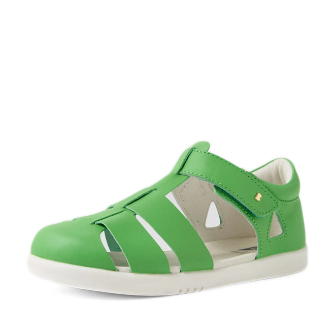 A single Bobux Kid + Plus Tidal Closed Toe Quick Dry Sandal in Retro Green, designed for children with cut-out details, a closed toe, and a white rubber sole, is displayed against a plain white background., 9420074809469, 9420074809476, 9420074809483, 9420074809438, 9420074809452, 9420074809445
