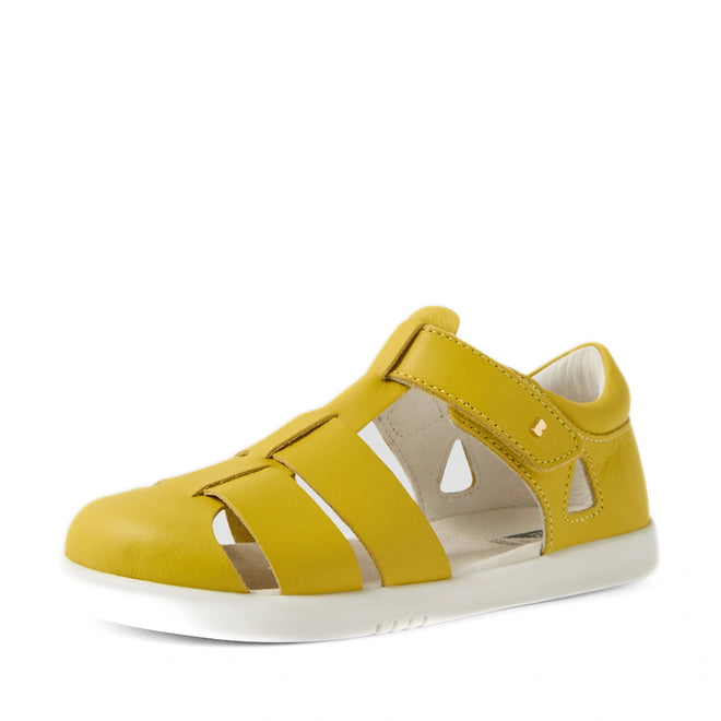 Mango Mint Bobux Kid + Plus Tidal Closed Toe Quick Dry Sandal for children, featuring a closed toe, cut-out sides, and an adjustable velcro strap atop a white rubber sole, displayed against a white background. Crafted from water-friendly leather, these sandals are the ideal choice for everyday adventures., 9420074809643, 9420074809650, 9420074809667, 9420074809674, 9420074809681