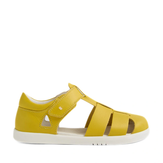 The Bobux Kid + Plus Tidal Closed Toe Quick Dry Sandal in Mango Mint is a yellow children’s sandal featuring a closed heel, velcro strap, open sides, and a white rubber sole. These closed-toe kids sandals are shown in profile against a white background., 9420074809643, 9420074809650, 9420074809667, 9420074809674, 9420074809681