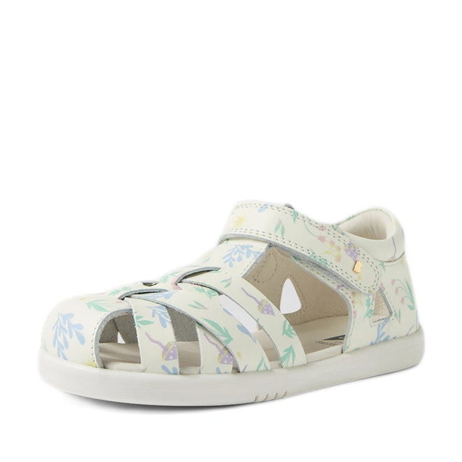 The Bobux Kids Plus KP Tropicana II White Floral Quick Dry Sandal is a stylish white leather kids' sandal featuring a charming floral pattern, closed-toe design, cut-out sides, and a convenient Velcro strap. Inspired by the popular Bobux Tropicana sandals, this sandal is both fashionable and comfortable for little feet. Displayed on a white background., 9420074861443, 9420074861450, 9420074861467, 9420074861405, 9420074861412, 9420074861429, 9420074861436