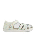 The Bobux Kids Plus KP Tropicana II White Floral Quick Dry Sandal is a white closed-toe sandal for kids, featuring a secure Velcro strap and crafted in the style of classic leather sandals. Adorned with pastel floral and nature-inspired patterns in purple, green, and yellow, it offers both comfort and charm. The lightweight design is complemented by a white sole with subtle grip for added stability, making this sandal perfect for everyday wear.