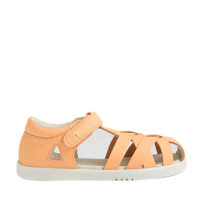 Introducing the Bobux Kids Plus KP Tropicana II Peach Jelly Quick Dry Sandal: a peach-colored children's sandal designed with inspiration from the classic Tropicana style. This podiatrist-approved kids’ shoe features a closed heel, open toe, and three crisscross straps for stylish support. It includes a comfortable hook-and-loop ankle strap and sits atop a durable white rubber sole, making it perfect for active little feet., 9420074861368, 9420074861337, 9420074861344, 9420074861351, 9420074861375