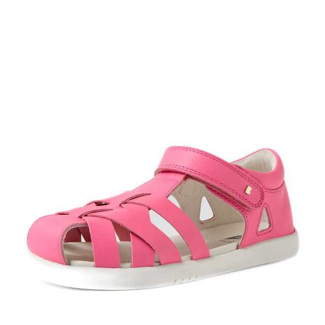 The Bobux Kids Plus KP Tropicana II Pink Lemonade Quick Dry Sandal is a pink children’s sandal featuring cut-out details, a closed toe, and a convenient velcro strap over the top. Shown on a white background, this stylish pair makes perfect kids’ summer shoes and is inspired by the Bobux Tropicana collection of closed-toe leather sandals., 9420074861153, 9420074861146, 9420074861139, 9420074861160, 9420074861122