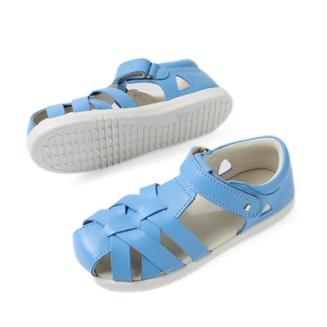 A pair of Bobux Kids Plus KP Tropicana II Baltic Sea Blue Quick Dry Sandals, featuring open toes, white soles, and velcro straps, is shown from the side and bottom view against a white background., 9420074861269, 9420074861276, 9420074861283, 9420074861290