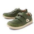 The Bobux KP Kids Plus Champ II Sneaker Bronze Green Juniors features green leather, beige soles and toes, two adjustable straps for easy wear, a durable sole, and a white logo patch on the side.