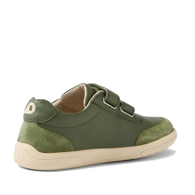 The Bobux KP Kids Plus Champ II Sneaker in Bronze Green Juniors features green leather, a beige durable sole, two adjustable straps, and suede heel and toe caps, shown angled on a white background., 9420074829573, 9420074829580, 9420074829597, 9420074829603, 9420074829610